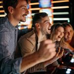 casino players showing excitement playing slots