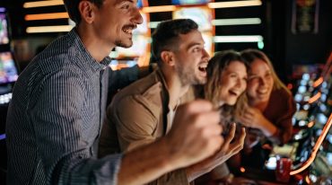casino players showing excitement playing slots