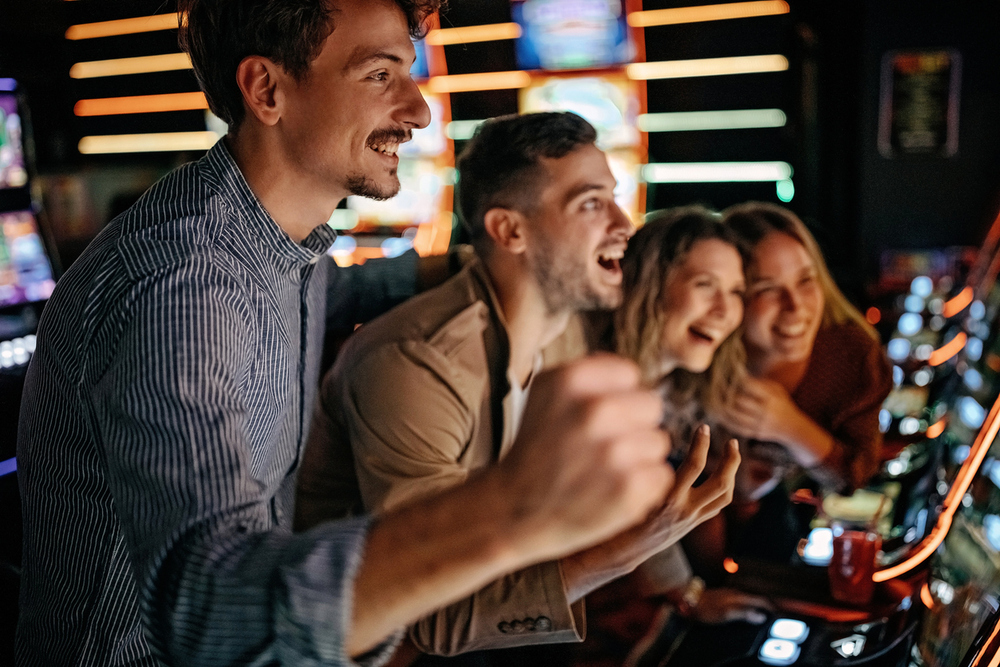 casino players showing excitement playing slots