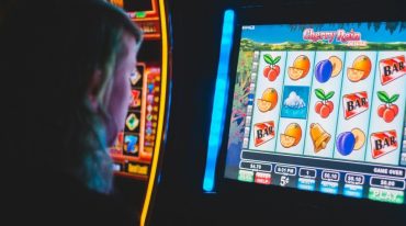 woman playing slot machines in casino