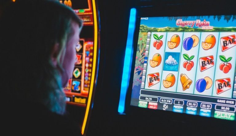 woman playing slot machines in casino