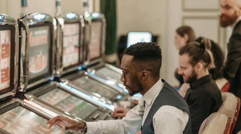 men playing slots in casino