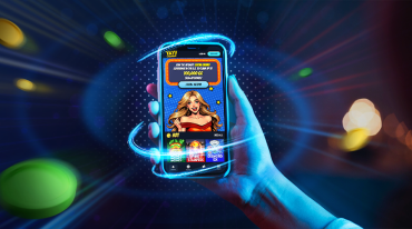 Holding a mobile device with Yay Casino on the screen